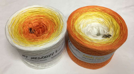2 cakes of the Wolltraum My Melodyy gradient yarn colourway Candy Corn.  It goes from white to orange.