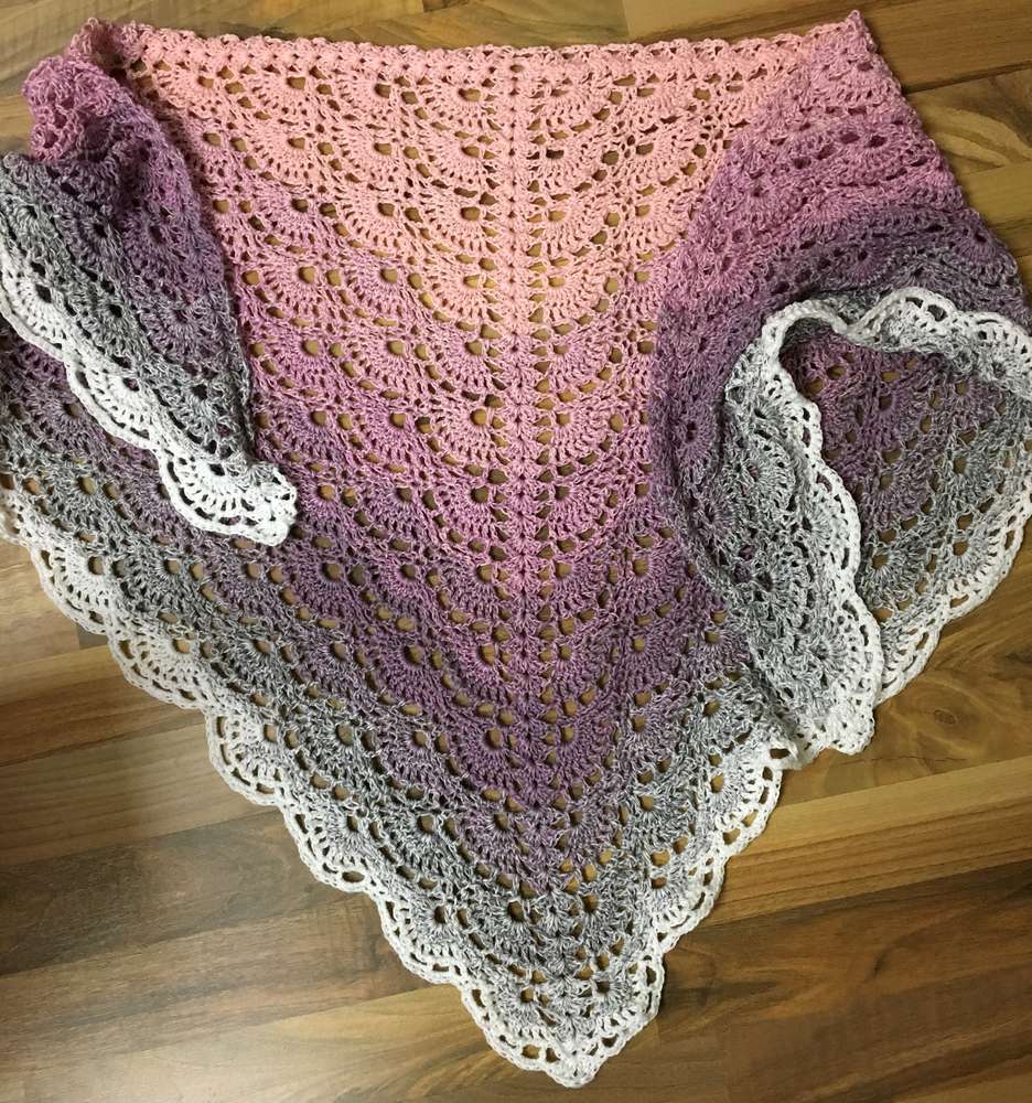 A crocheted shawl made with Wolltraum yarn in the colour Careless Whisper.
