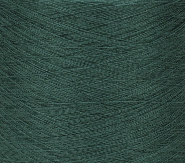 A closeup of emerald green single-ply yarn.