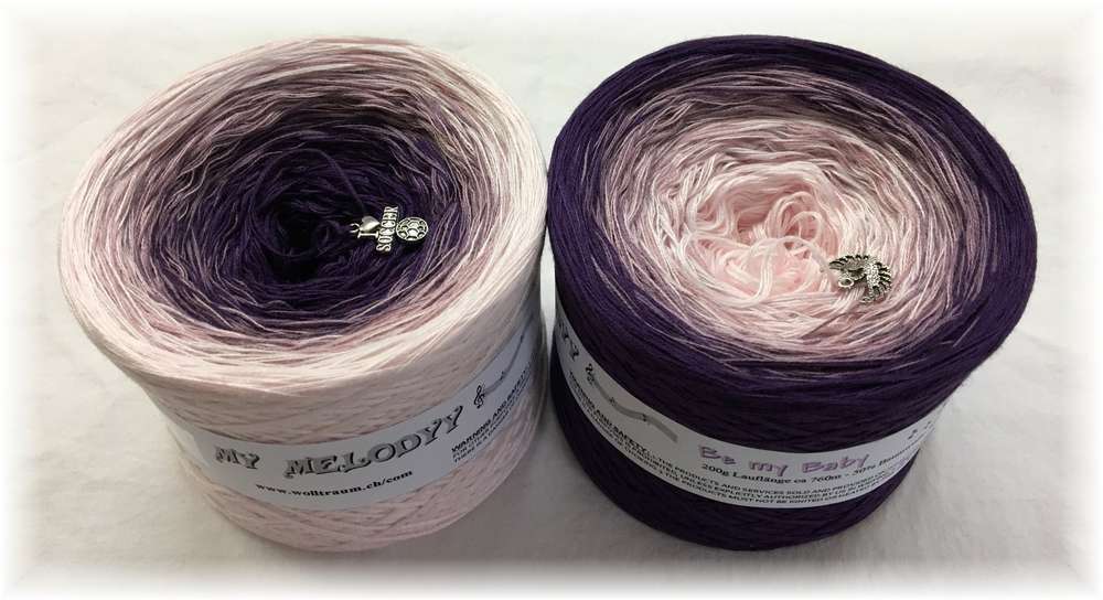 2 cakes of the Wolltraum My Melodyy gradient yarn colourway Be My Baby.  It goes from a soft pink to a deep purple.