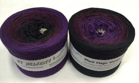 2 cakes of the Wolltraum My Melodyy gradient yarn colourway Black Magic Woman.  It goes from a deep purple to black.