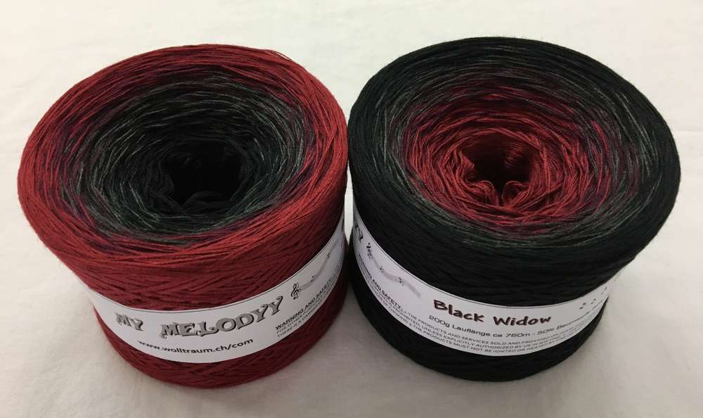 2 cakes of the Wolltraum My Melodyy gradient yarn colourway Black Window.  It goes from a deep red to black.