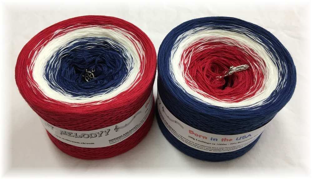 2 cakes of the Wolltraum My Melodyy gradient yarn colourway Born in the USA.  It goes from dark blue to white to red.