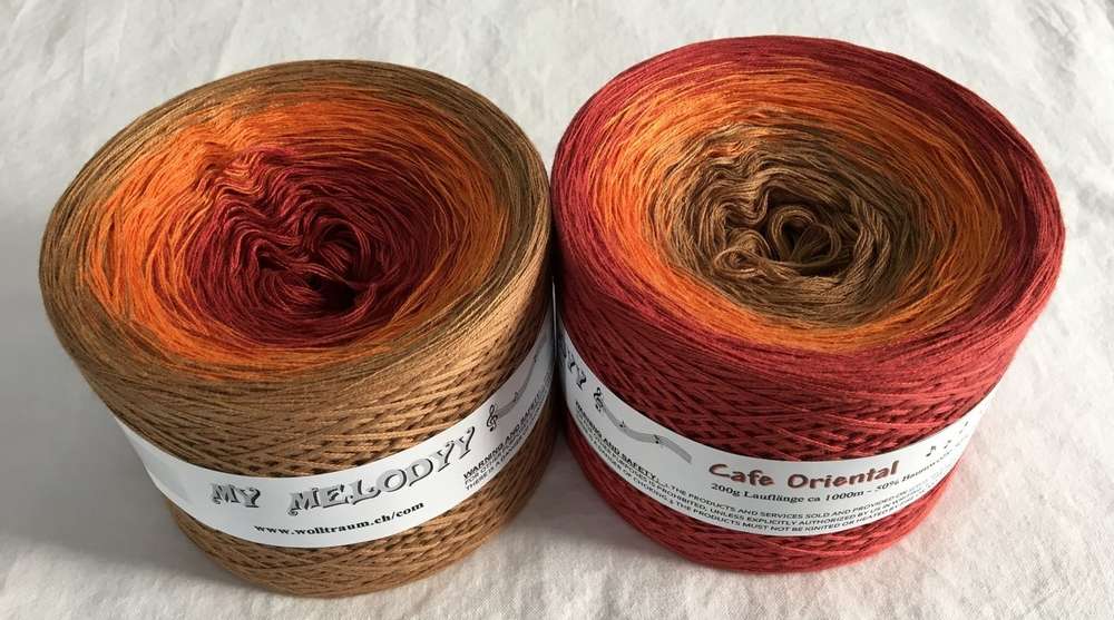 2 cakes of the Wolltraum My Melodyy gradient yarn colourway Cafe Oriental.  It goes from red to orange to beige.