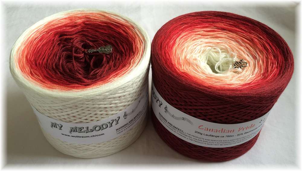2 cakes of the Wolltraum My Melodyy gradient yarn colourway Canadian Price.  It goes from off-white to red.