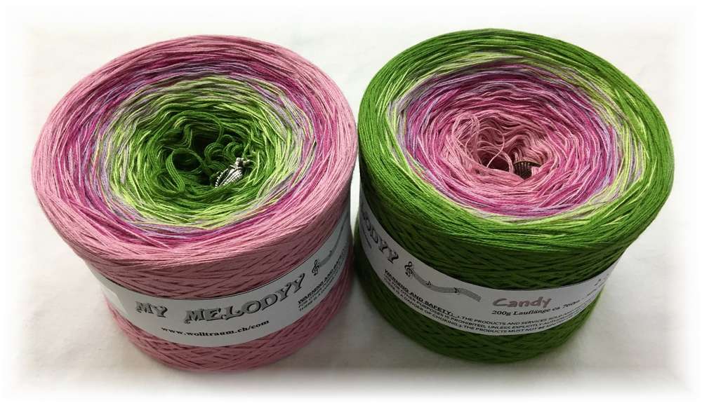 2 cakes of the Wolltraum My Melodyy gradient yarn colourway Candy.  It goes from pink to green.