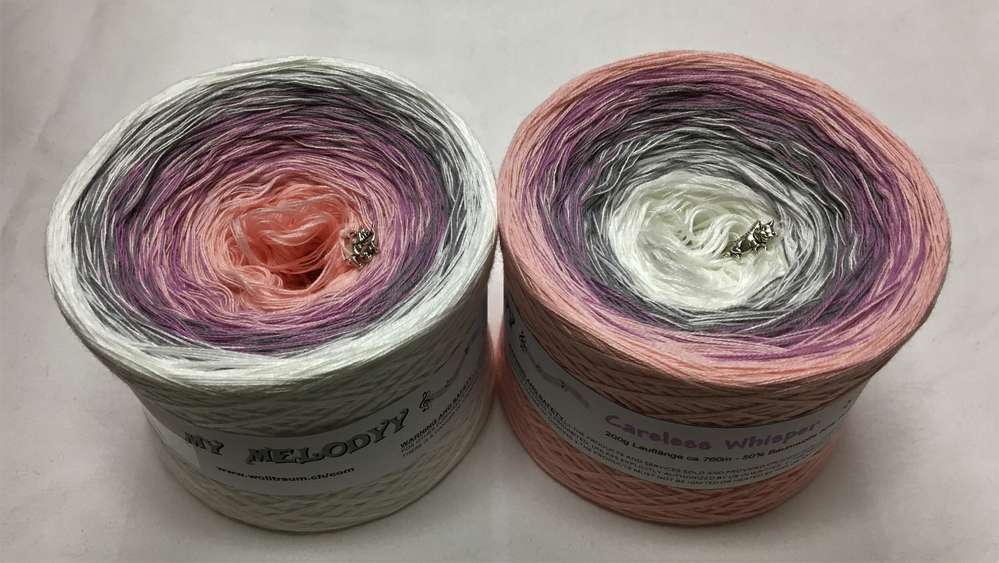 2 cakes of the Wolltraum My Melodyy gradient yarn colourway Careless Whisper.  It goes from white, to grey, to pink.