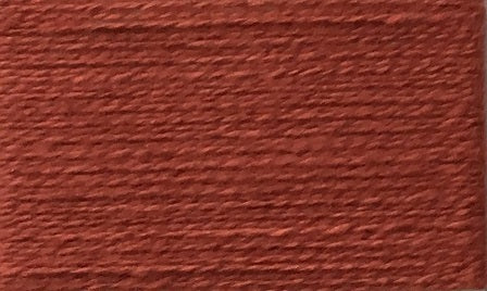 A closeup of the Wolltraum yarn single colour Brick.  It is an deep orange red mix.